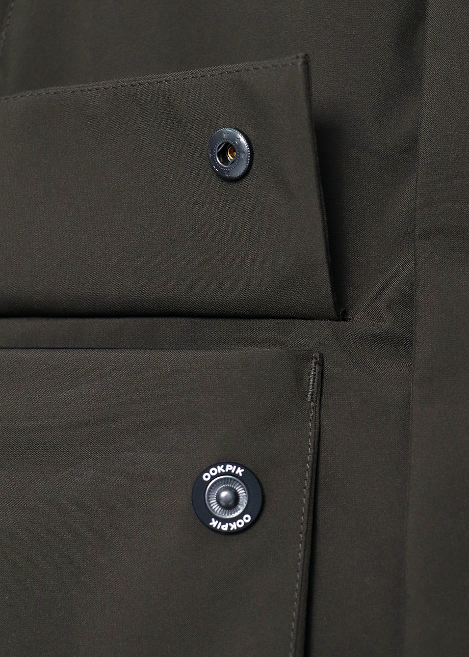 OOKPIK-STUART-LEAF SNAP BUTTONS ON POCKET DETAIL